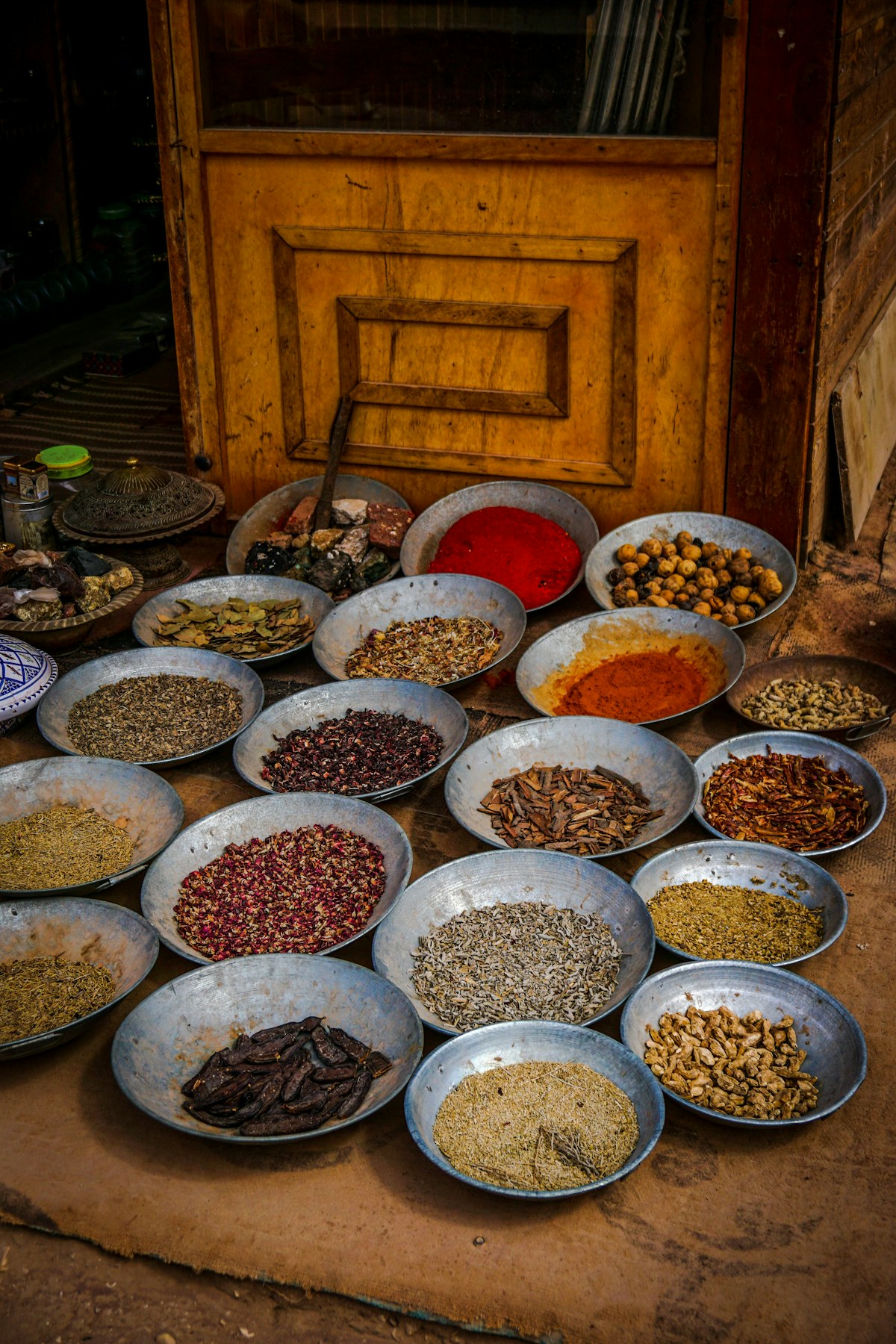 Bowls of whole spices at a spice market