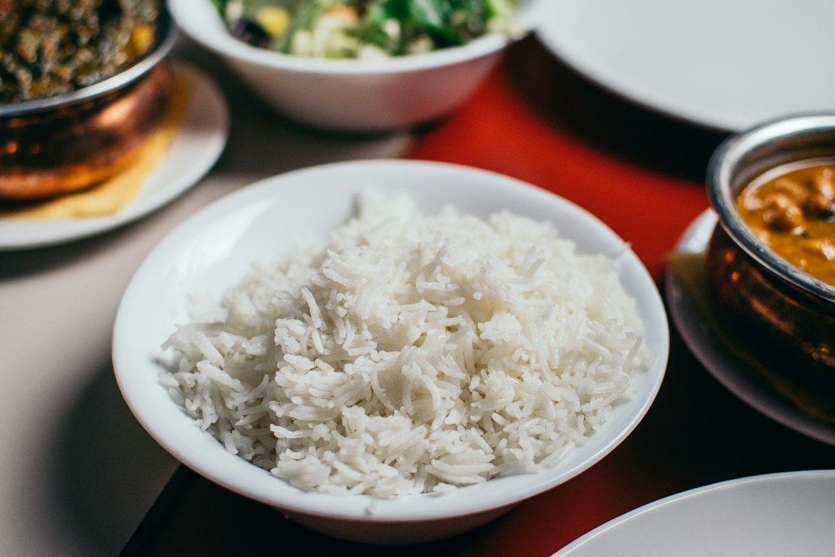 Cooked rice served with curries